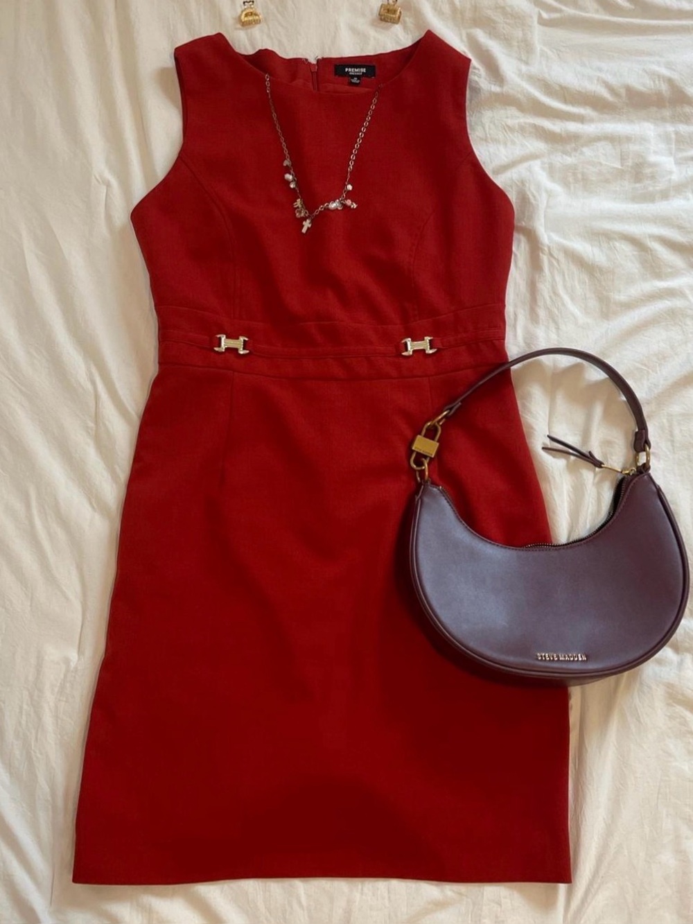 Deep red sleeveless midi dress with a clean, tailored silhouette